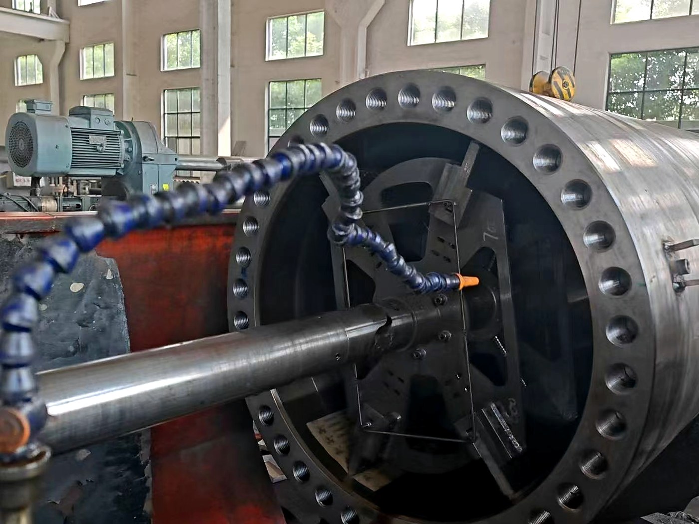 Large cylindrical component being machined in the YiGuo workshop